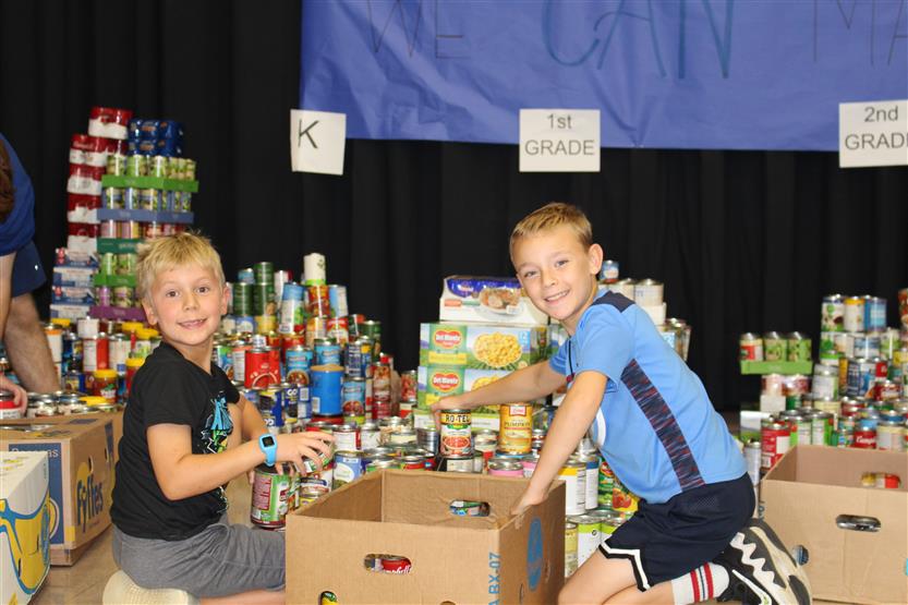 Students collect food for a can drive